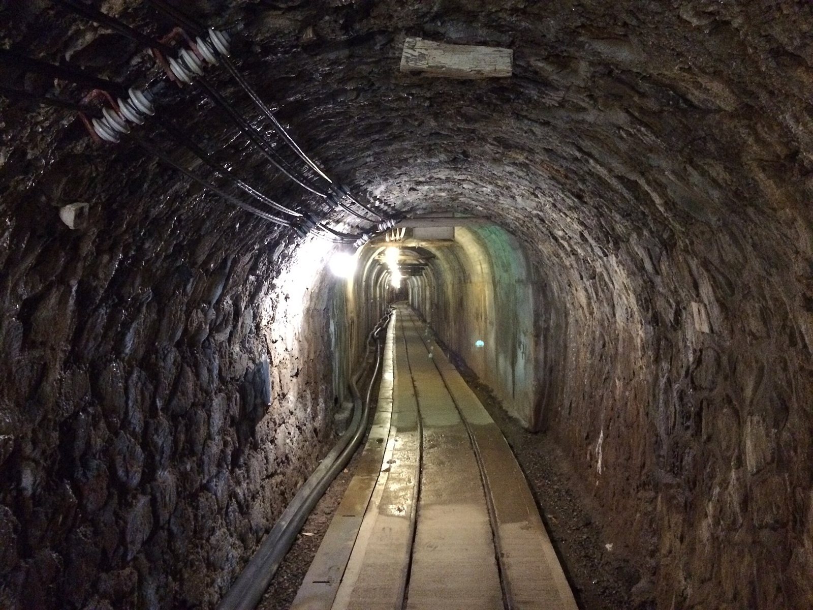 Illuminated underground rock tunnel at the historic Sado gold mine in Japan